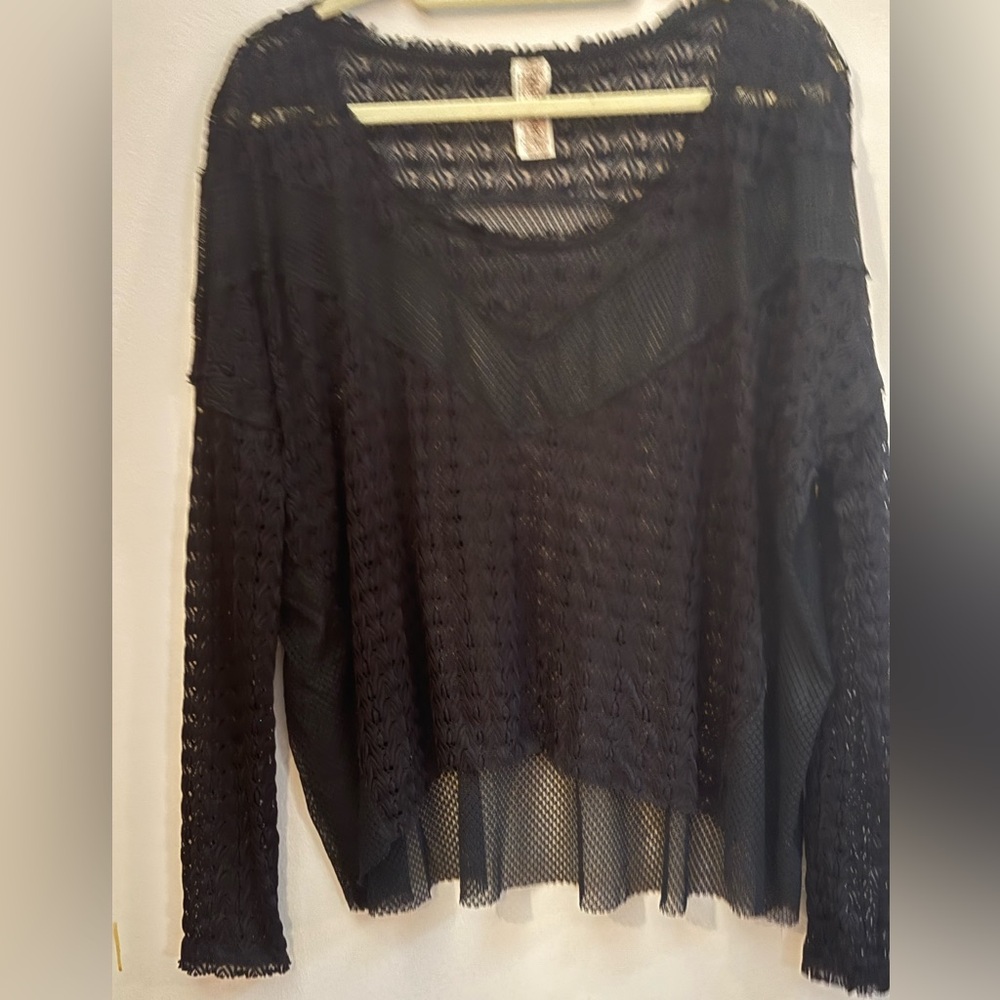 Free People high low black top. Size L